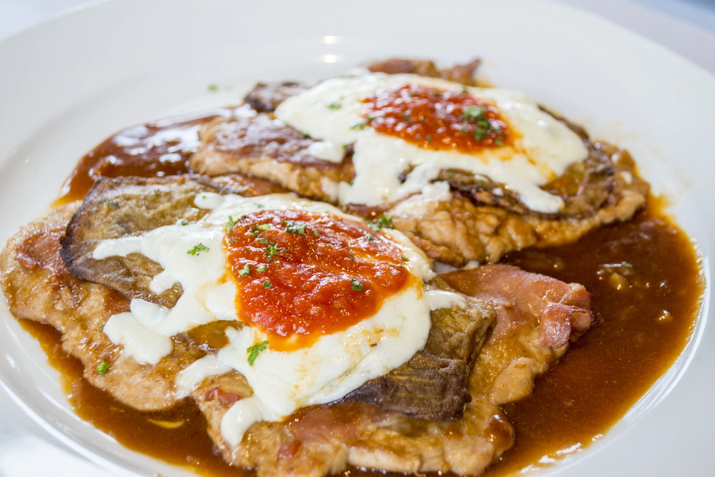   Vitello Sorrentino ($19.95) features thinly-pounded veal topped with eggplant and parma prosciutto, Fontina cheese and a Maderia wine sauce.  