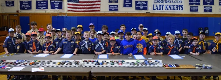   Prior to the start of the Matinecock District’s annual pinewood derby race, all of the participating Tigers, Cubs and Webelos pose for a photo with the racecar entries.   (Photos courtesy of Phyllis Stein)  