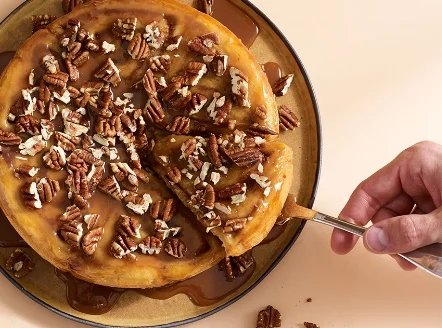 Nonna’s pan cinnamon rolls, the new brunch item at Del Frisco’s Grille, is covered with house-made bourbon espresso caramel and candied walnuts.