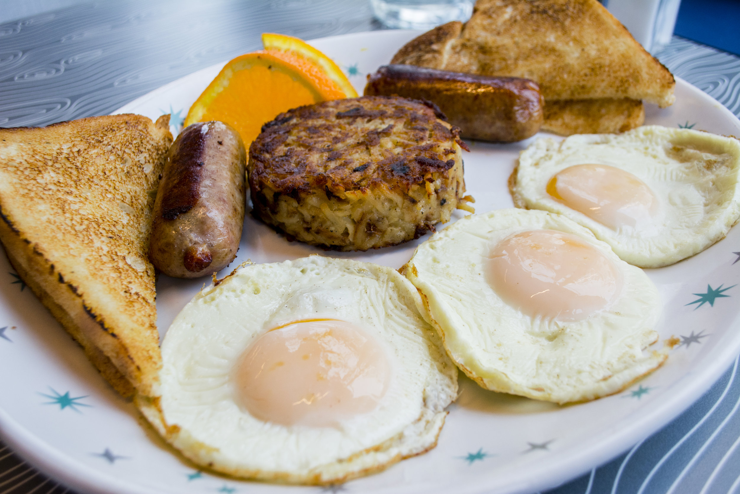   The Classic ($10.75) features three eggs, any style, with a side of hash browns, choice of protein and toast.  