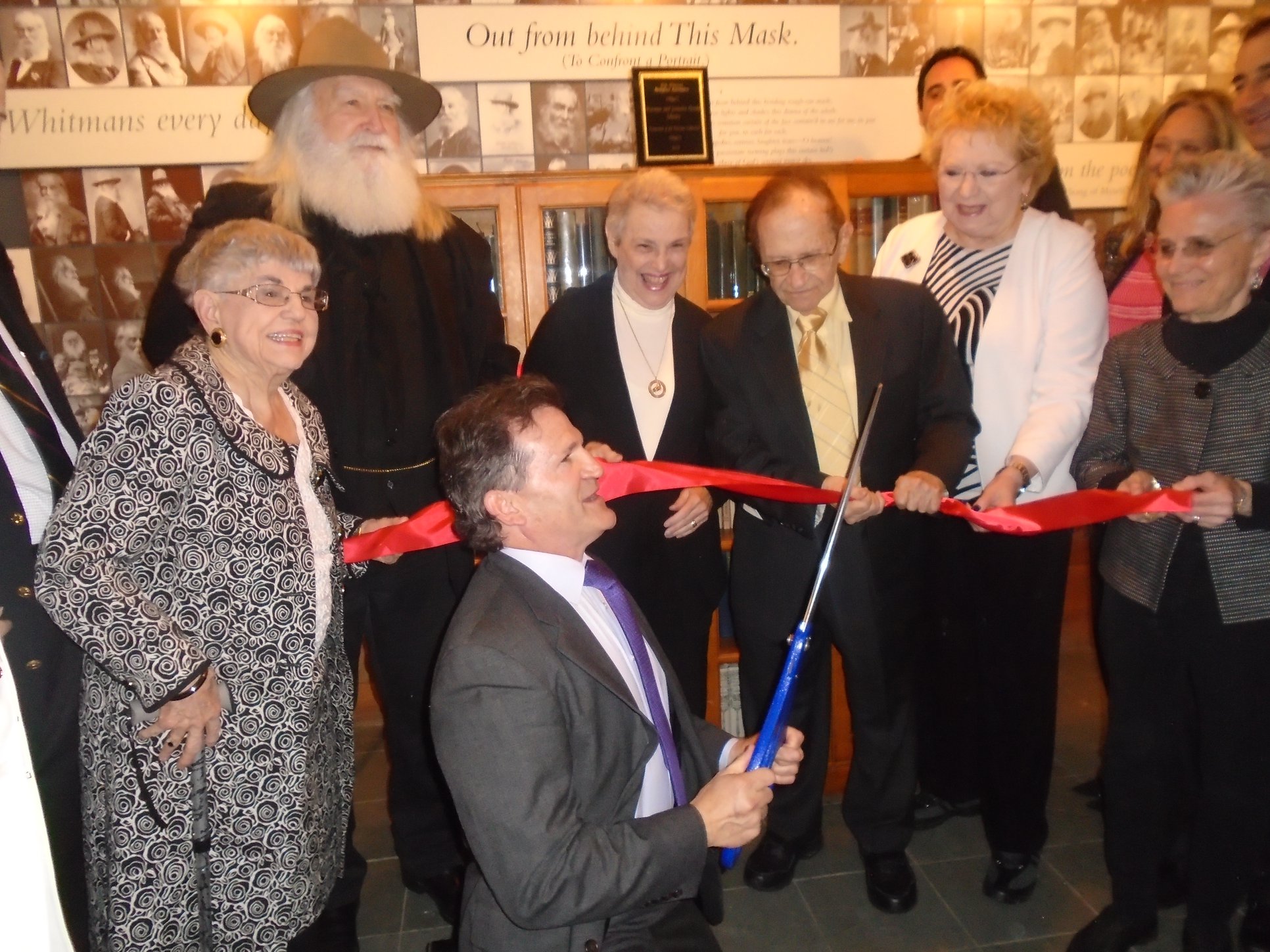  The ribbon is cut, unveiling the Norman and Jeanette Gould Library at the Birthplace. 