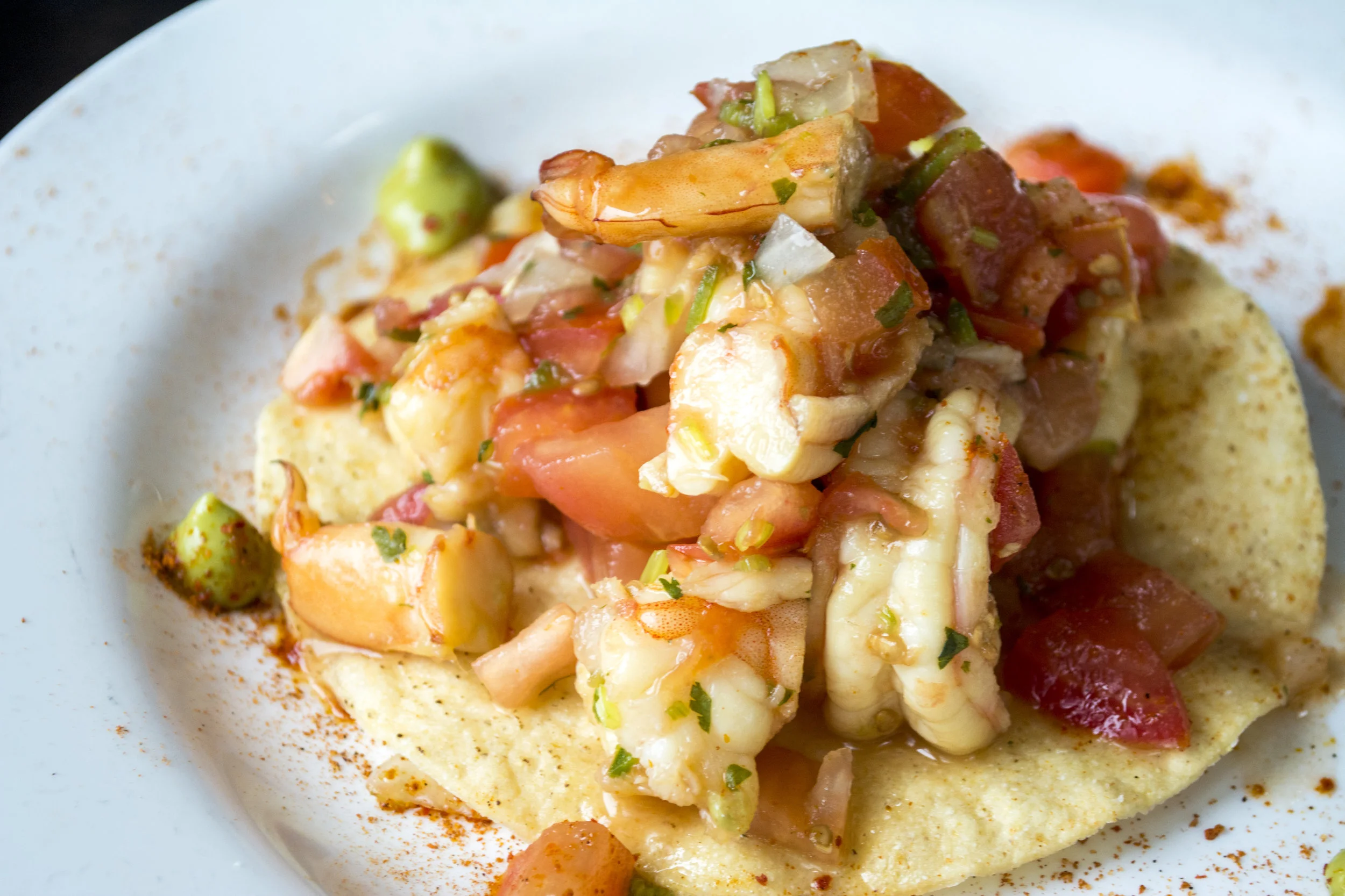   Shrimp Ceviche Tostada ($14) features shrimp, tomato, lime and jalapeno over a crisp tortilla.  