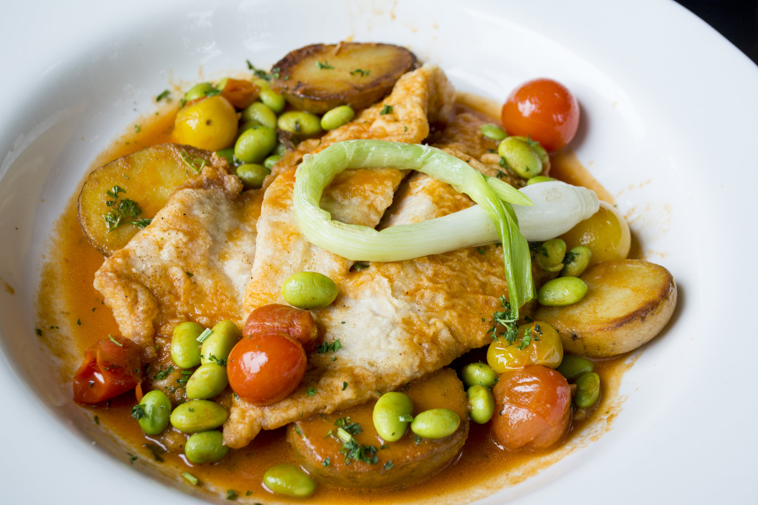   Local John Dory ($24) is served with yellow finn potatoes, baby spring onion, edamame and tomato broth.  