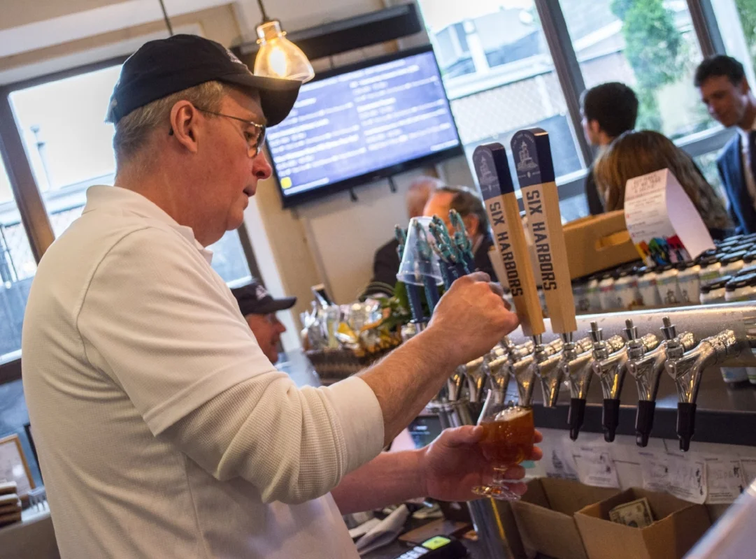   Investor Jim Murray doubles as a bartender in the tasting room.  