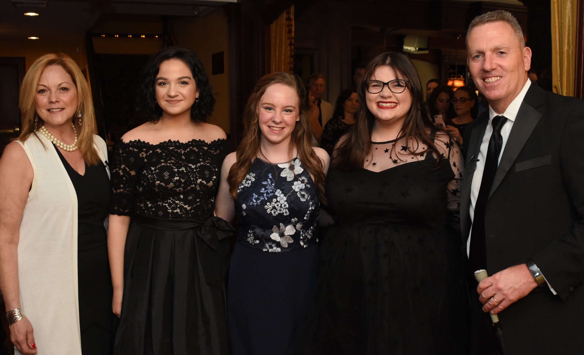   Hosts of the 2018 Hunting-Tonys, Councilman Mark Cuthbertson, far right, and Councilwoman Joan Cergol, far left, with, from left: Isabella Donneruno, Meaghan Maher and Sara Meade, each of whom performed in Northport High School’s production of “The