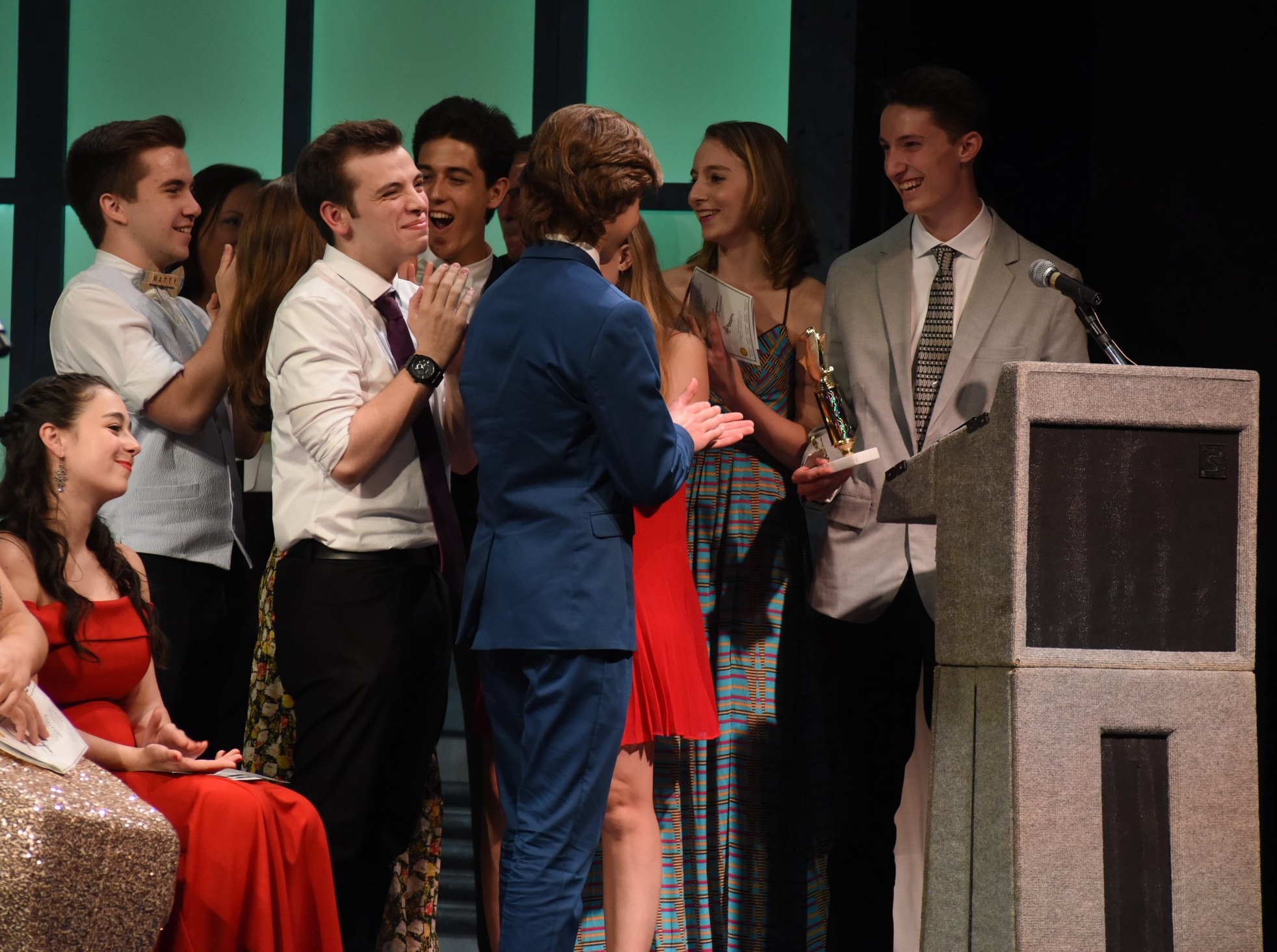   The cast of Harborfields High School’s production of “The 25th Annual Putnam County Spelling Bee” celebrates after winning “Best Ensemble in a Musical.”  