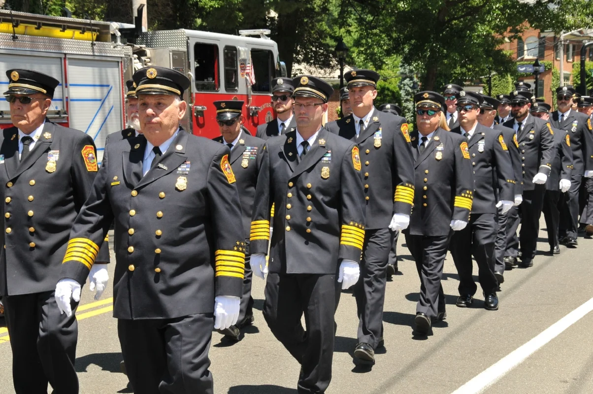   Members of the Cold Spring Harbor Fire Department march to Saturday’s 9/11 memorial dedication ceremony.  