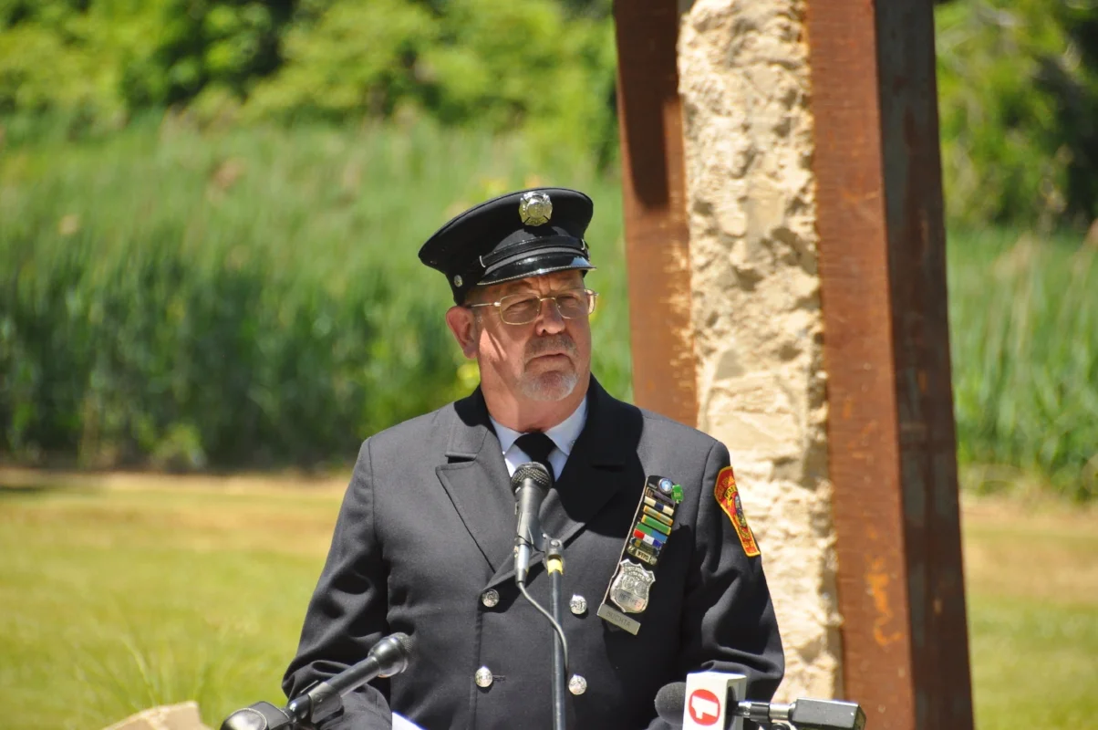   Memorial committee chairman and retired Port Authority police officer Thomas Buchta speaks at the ceremony.  