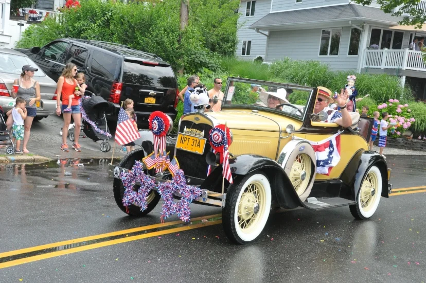   Bruce Adams drives a 1931 Ford, one of many antique cars that joined the parade.  