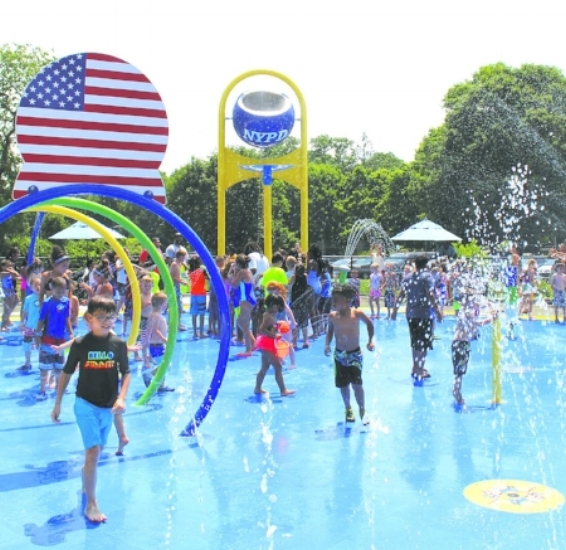  Children splash their way through Huntington’s first spray park on Wednesday.   (Long Islander News photos/Tatiana Belanich)  