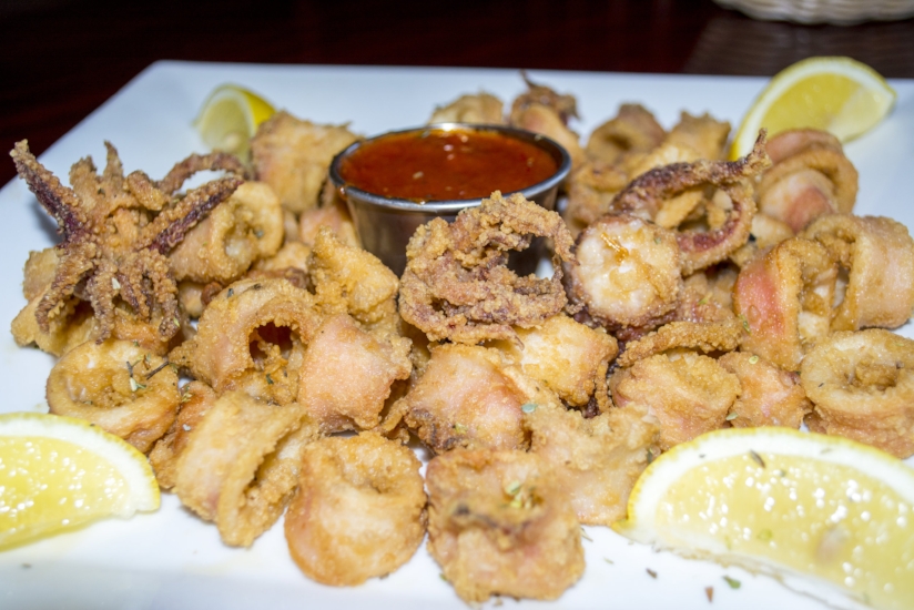   Fried Calamari ($12) features lightly battered squid that is fried and served with marinara sauce and lemon.   (Long Islander News photos/Connor Beach)  