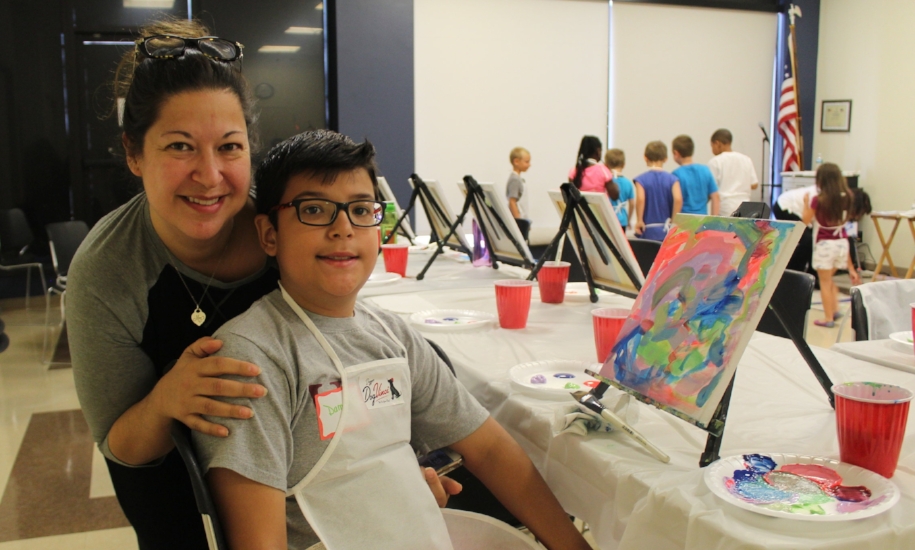   Michelle Laredo-Torres with son Damian, 9, and his creation  