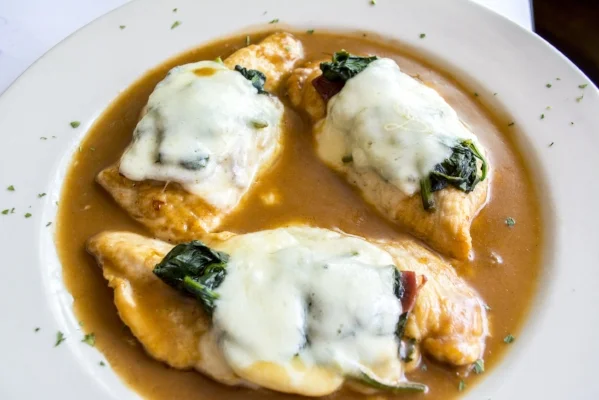   Chicken Florentine ($22/$29) features chicken topped with spinach, prosciutto and mozzarella served with a sherry sauce.  