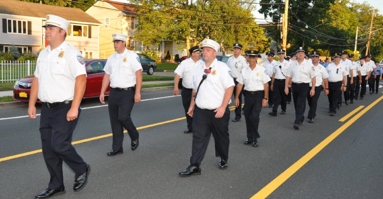   Members of the Huntington Fire Department led by Chief Robert Conroy.  