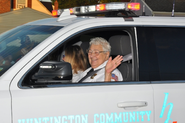   Andrea Golinsky, ex-chief of the Huntington Community First Aid Squad, waves to the crowd.  