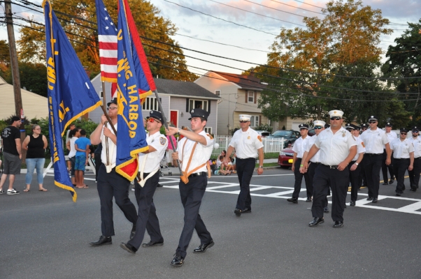   Members of the Cold Spring Harbor and Halesite fire departments march together.  