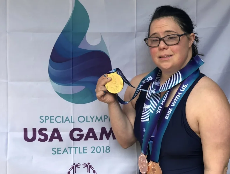 Swimmer Danielle Birnbaum shows off the gold medal she won at the Special Olympics in Seattle. Photo by Laura Birnbaum