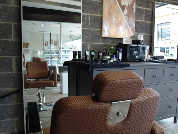 The Men’s Shop has a masculine feel with exposed masonry walls, grey accents and new leather and steel barber chairs.