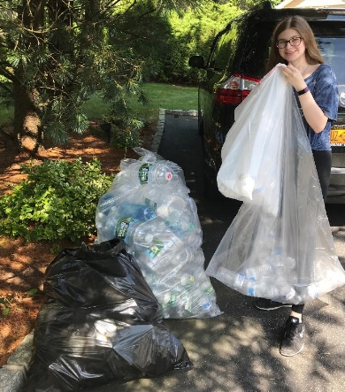 Half Hollow Hills High School East senior Janna Zilka collects and redeems bottles and donates the proceeds to charity.