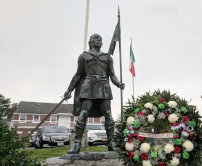 The Italian flag will fly above the Christopher Columbus Statue at Lawrence Hill Road and Main Street in Huntington village during Italian-American Heritage Month. Photo/Town of Huntington