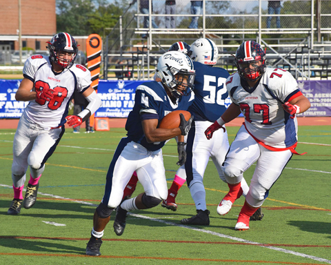  Huntington’s Nasir Youngblood gains yardage for the Huntington Blue Devils during their Homecoming game.   Photos/Huntington School District    