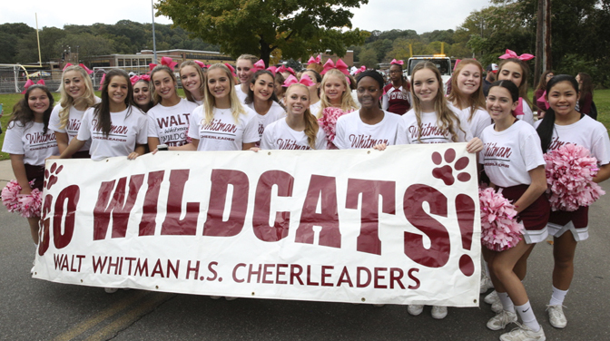    The Walt Whitman Cheerleaders ready to root for the home team after marching in the parade.  Photos/Spouth Huntington School District  