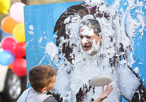  Birchwood Principal Anthony Ciccarelli gets a face full of whipped cream at the homecoming festival. 