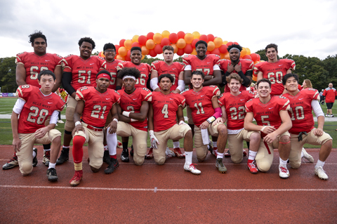  Hills West senior football players pose before last week’s homecoming game.  