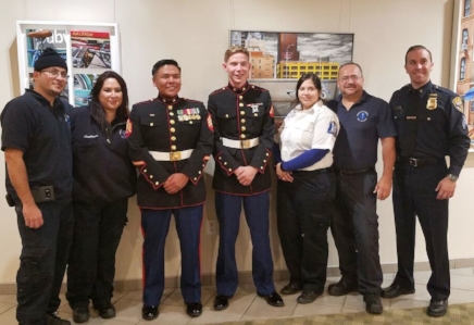 Members of the Huntington Community First Aid Squad stand with USMC Sergeant Jeff Silentwalker, USMC Lance-Corporal Joseph Kaye and Auxiliary Police Sergeant Douglas Henningsen.