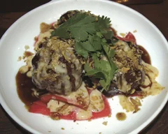The Wagyu Meatballs ($12) on the appetizer menu at IMC Restaurant (279 Main St, Huntington). are served with pickled green daikon and spicy mayo, topped off with a coconut and garlic crumble and cilantro. They melt in your mouth and have exquisite flavors that come together in harmony.