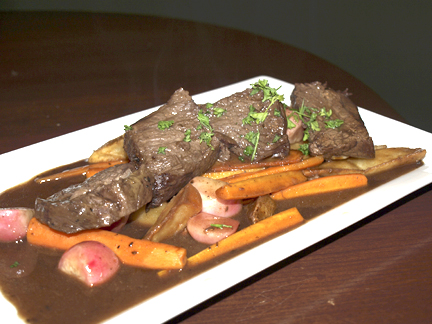  Braised short rib ($21.99) in a red wine dijon reduction with roasted carrots, radishes, and potato wedges. 