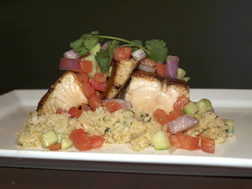  Seared wild salmon ($17.99) on a cauliflower “couscous” dressed with mint, tomato, red onion, cucumber, and lemon vinaigrette. 