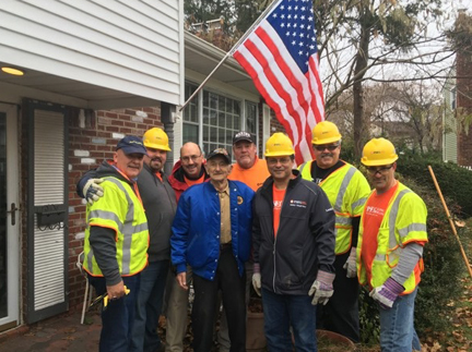 Volunteers from PSEG Long Island and Moonjumpers helped WWII veteran Morris Koffer clean up his home and yard. Moonjumpers photo