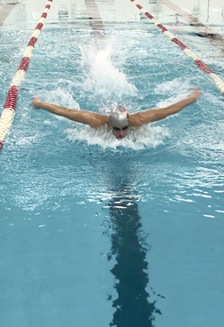 Swimmer Kabir Randhawa puts power into his butterfly stroke.