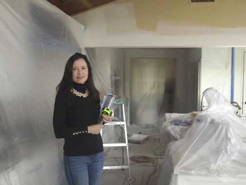 Fresh Design Group founder Sharon Gunther is armed with a tape measure and project plans in the midst of a remodeling project.