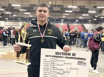 Commack senior Joey Slackman celebrates after winning the Suffolk County championship in the 285-pound division.