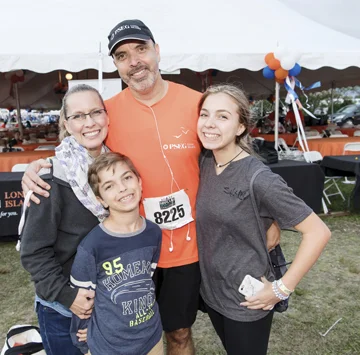 Jorge Jimenez completes another race in preparation for the Boston Marathon, with the support of his wife, Leanne, and children, Tomas and Karina.