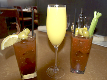  A trio of cocktails: Bourbon Bloody Mary, Prosecco Mimosa, and Traditional Tito’s Bloody Mary.  