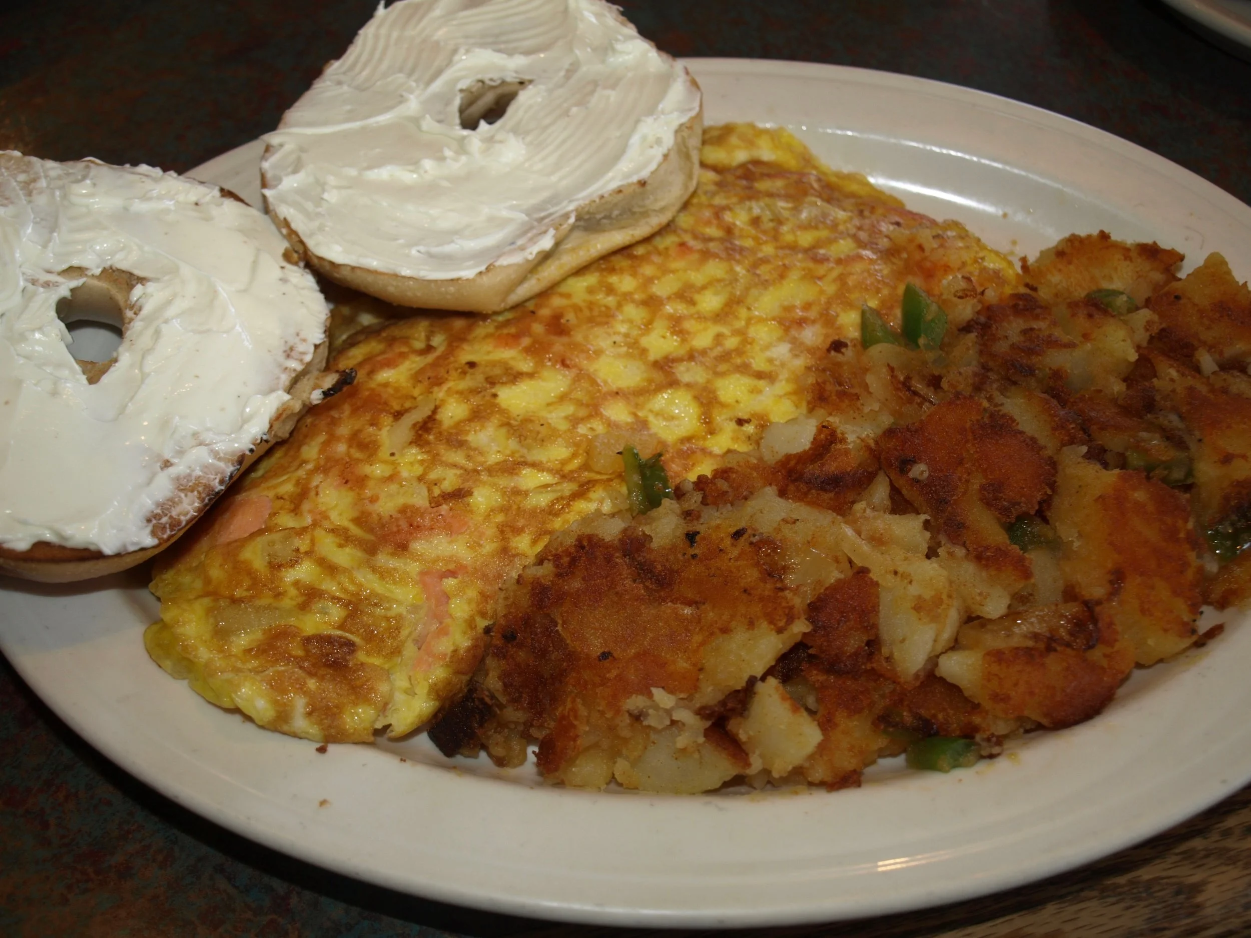  Nova lox omelette with home fries and a toasted bagel. 