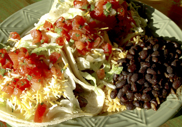  Carne asada tacos feature grilled skirt steak, lettuce, pico de gallo, mexican cheese and poblano aioli  