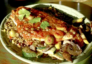  Crispy pan-seared red snapper fillet with tomato, habanero sauce, capers, olives, grilled vegetables and rice. 