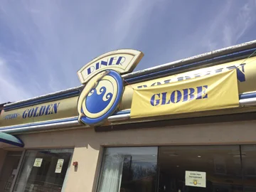 A banner on the sign of the former Golden Dolphin Diner in Huntington shows the diner’s name has been changed to the Golden Globe.