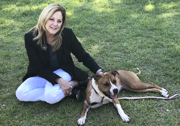 Huntington Councilwoman Joan Cergol at the Huntington Animal Shelter with former stray Penelope.