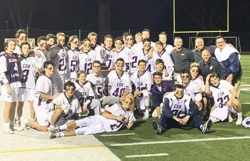 Cold Spring Harbor boys lacrosse celebrates after beating Huntington 8-3. Photo/Cold Spring Harbor Schools