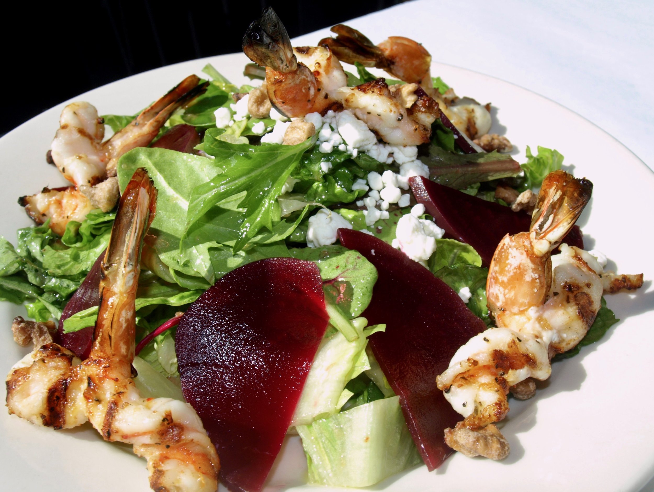 Beet salad of mixed greens, goat cheese, walnuts and balsamic dressing