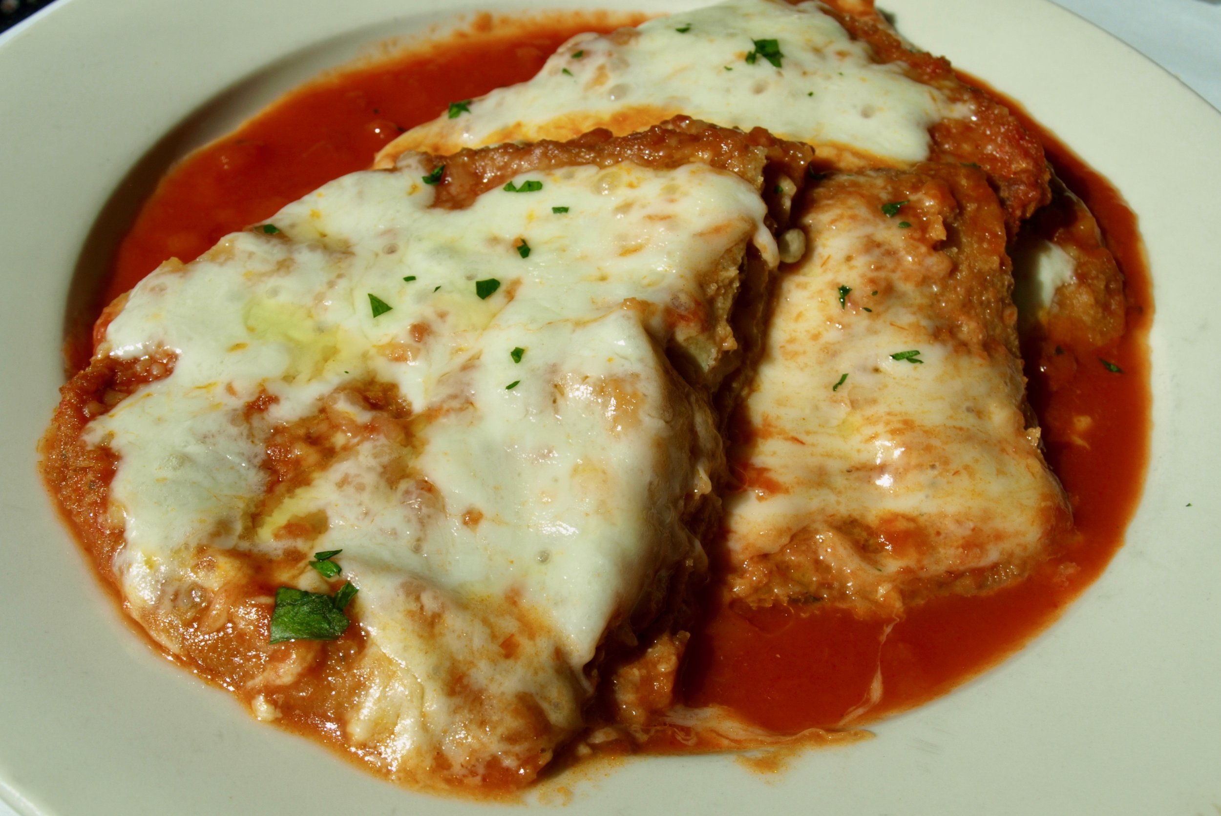 Eggplant parmigiana layered with mozzarella.