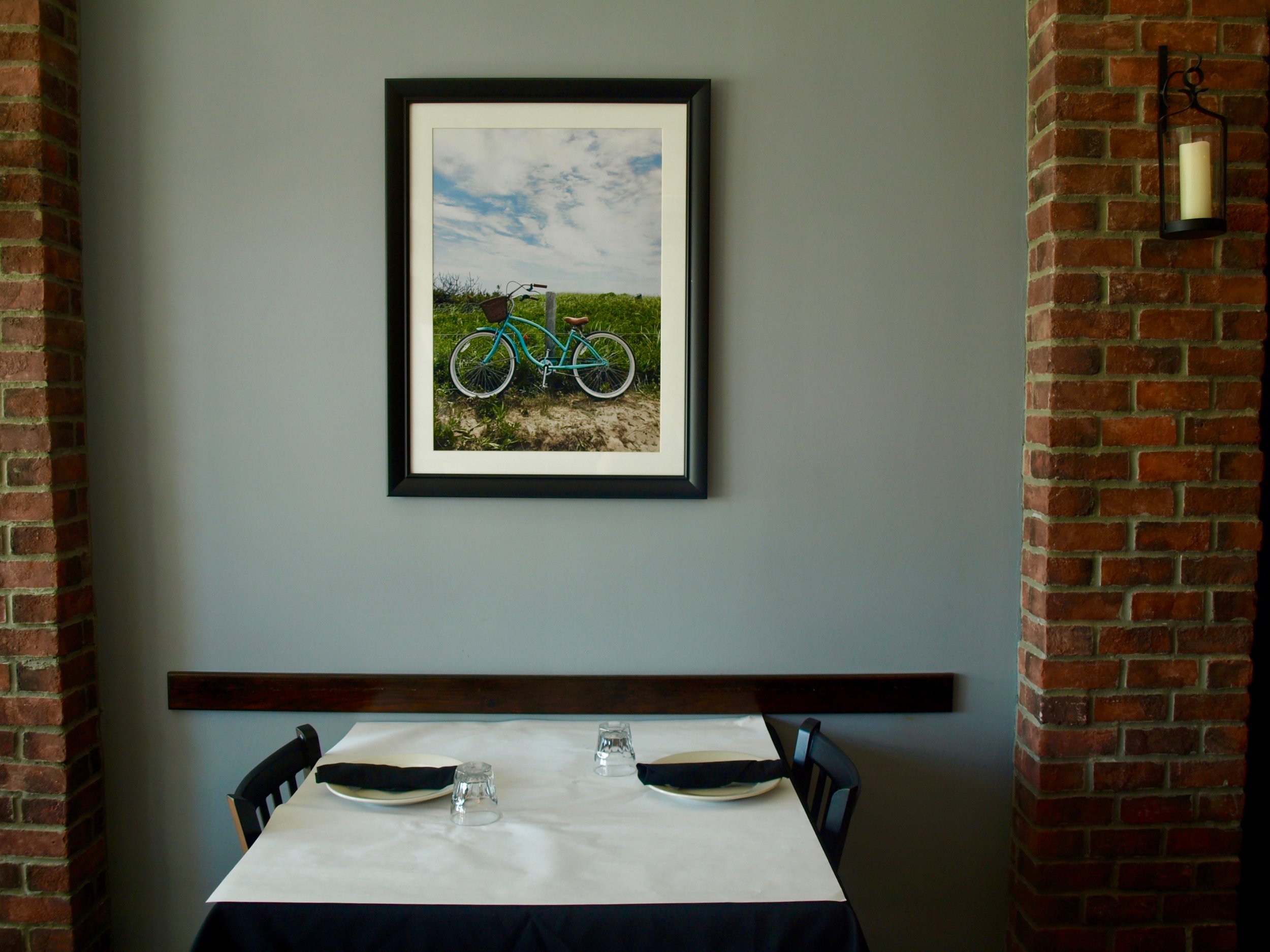 Eatalia’s interior features photographs taken by a member of the Salese family.