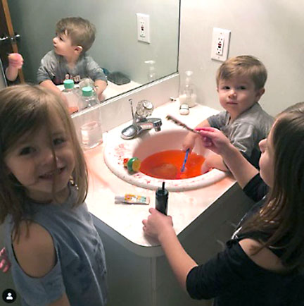 The original picture that captured Clorox’s attention of the Madden kids playing with a bath bomb in the bathroom sink.