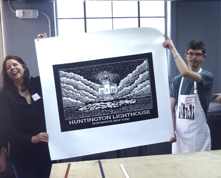   Jen and Theo Lau show her fresh-off-the-press print of Huntington Lighthouse.  