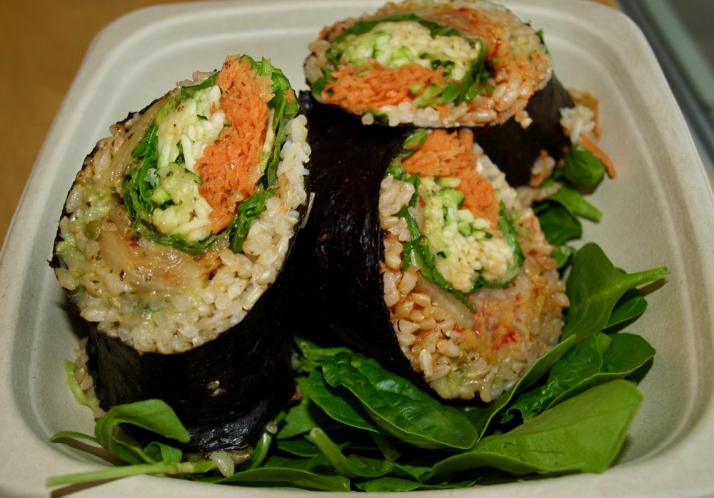   The zen roll, with spicy kimchi, brown rice, avocado mash, zucchini noodles, arugula, carrots, and thai dressing.  